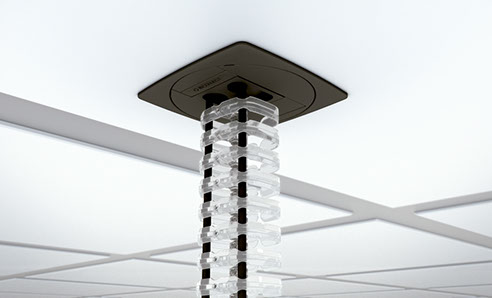 photo d'une gaine de plafonnier transparente pour câbles ordinateur, secteur etc