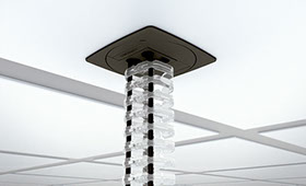 photo d'une gaine de plafonnier transparente pour câbles ordinateur, secteur etc